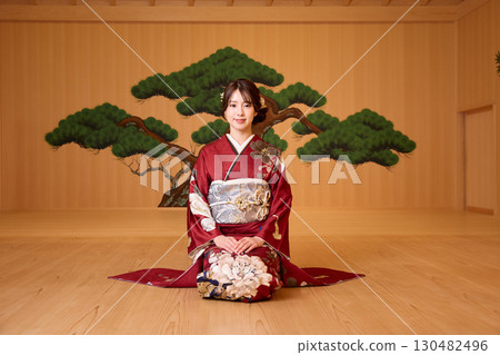 Japanese woman in furisode kimono standing on the Noh stage Japanese woman in furisode kimono standing on the Noh stage 130482496