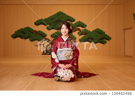 Japanese woman in furisode kimono standing on the Noh stage Japanese woman in furisode kimono standing on the Noh stage 130482498