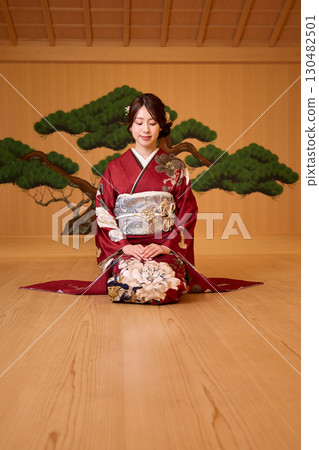 Japanese woman in furisode kimono standing on the Noh stage Japanese woman in furisode kimono standing on the Noh stage 130482501
