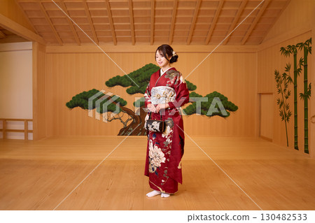 Japanese woman in furisode kimono standing on the Noh stage Japanese woman in furisode kimono standing on the Noh stage 130482533