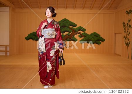 Japanese woman in furisode kimono standing on the Noh stage Japanese woman in furisode kimono standing on the Noh stage 130482552