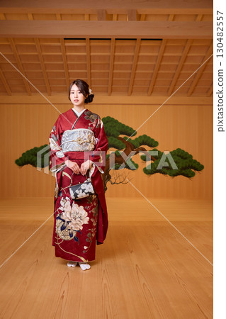 Japanese woman in furisode kimono standing on the Noh stage Japanese woman in furisode kimono standing on the Noh stage 130482557