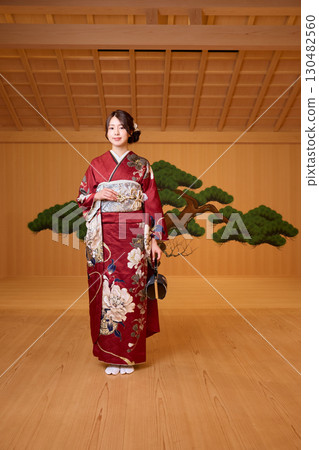 Japanese woman in furisode kimono standing on the Noh stage Japanese woman in furisode kimono standing on the Noh stage 130482560