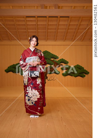 Japanese woman in furisode kimono standing on the Noh stage 130482561