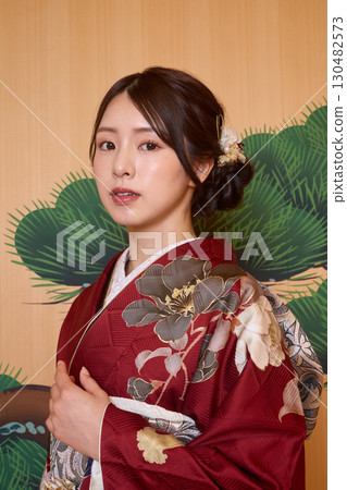 Japanese woman in furisode kimono standing on the Noh stage Japanese woman in furisode kimono standing on the Noh stage 130482573