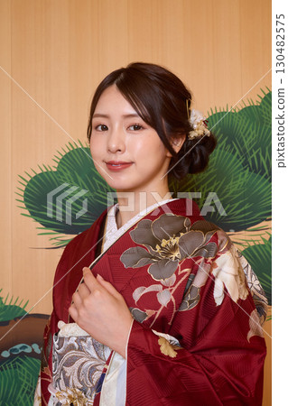 Japanese woman in furisode kimono standing on the Noh stage Japanese woman in furisode kimono standing on the Noh stage 130482575