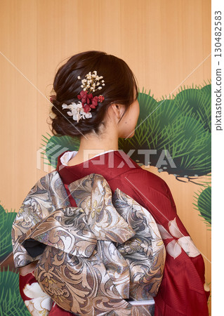 Japanese woman in furisode kimono standing on the Noh stage 130482583
