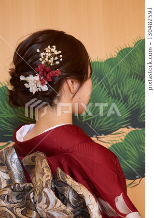 Japanese woman in furisode kimono standing on the Noh stage 130482591