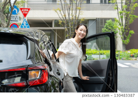 Female car parked on the street 130483387