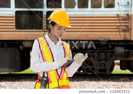 Asian young teen engineer worker work in Train station, Locomotive service station 130483552
