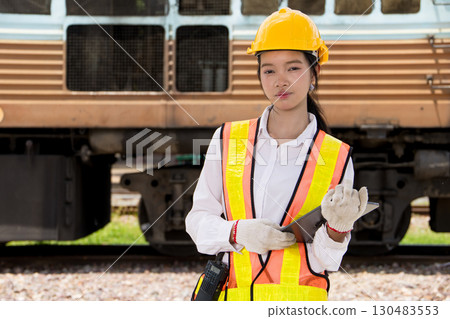 Portrait Asian young teen engineer worker work in Train station, Locomotive service station 130483553