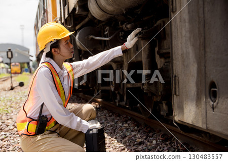 Asian young teen engineer worker work in Train station, Old locomotive service maintenance 130483557