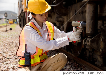 Asian young teen engineer worker work in Train station, Old locomotive service maintenance 130483558