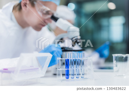Scientist working in science lab. Medical lab people, Pharmaceutical medicine research laboratory. Scientist working in science lab. Medical lab people, Pharmaceutical medicine research laboratory. 130483622