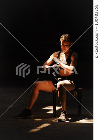 Muay thai, strong women fighter wrapped fist to Bare Knuckle fighting Asian kick boxing style people Muay thai, strong women fighter wrapped fist to Bare Knuckle fighting Asian kick boxing style people 130483859