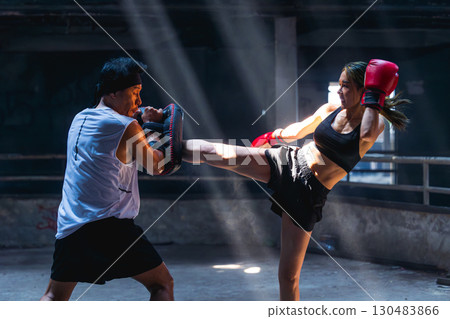 Thai boxing, Women fighter training kick boxing with trainer in ruin building ,Asian martial arts 130483866