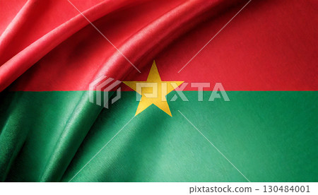 Folded flag of Burkina Faso with visible satin texture 130484001
