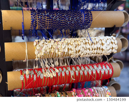 Colorful bead bracelets on market stand. Fashion, craft, and handmade accessories for personal style. Colorful bead bracelets on market stand. Fashion, craft, and handmade accessories for personal style. 130484199