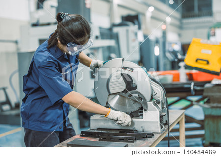 young teen technician Industry engineer student learning using metal machine in university workshop 130484489