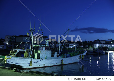 A fishing boat anchored A fishing boat anchored 130484609