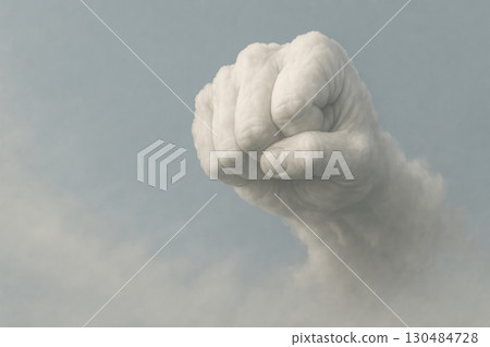 A cloud in the shape of a clenched fist. Space for text. 130484728
