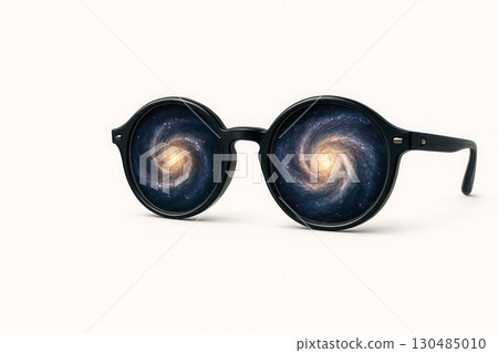 Glasses in which galaxy spirals rotate. Space for text. 130485010