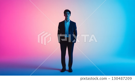 confident man in suit neon pink and blue studio portrait confident man in suit neon pink and blue studio portrait 130487209
