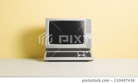 vintage computer on yellow background 130487436