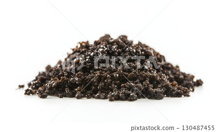 dark brown granular substance on white background dark brown granular substance on white background 130487455