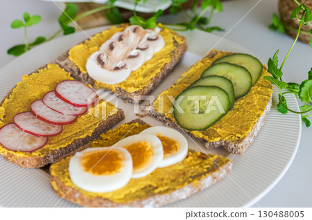 Delicious Hummus Sandwiches with Fresh Toppings 130488005