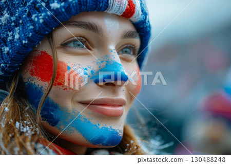 A joyful French woman with his face painted in the blue white and red colors of the France flag, cheering at a football match, with a blurred stadium background. AI Generative 130488248