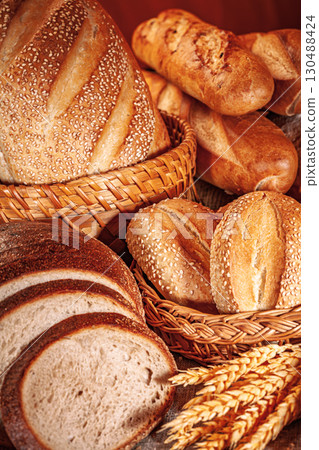 Fresh baked bread. Assorted bakery products loafs of bread and rolls... 130488424