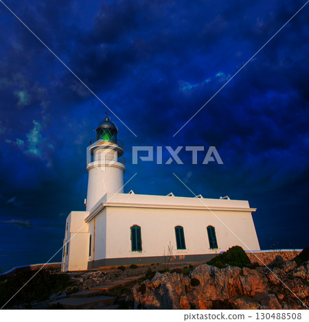 Menorca sunset at Faro de Caballeria Lighthouse 130488508