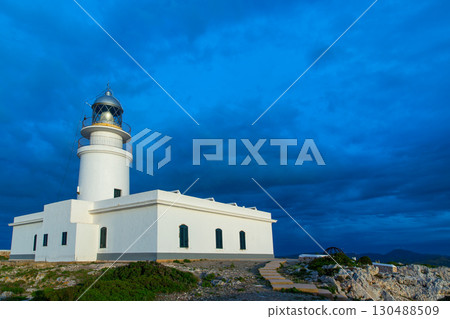 Menorca sunset at Faro de Caballeria Lighthouse 130488509