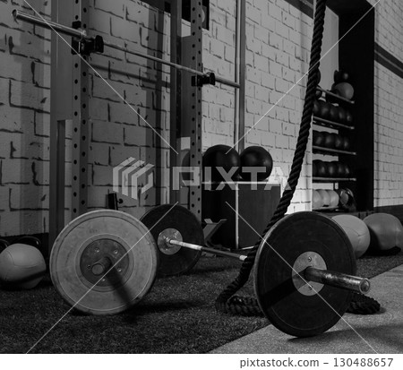 Barbells in a gym bar bells and rope 130488657