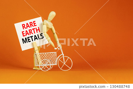 Rare earth metals symbol. Concept words Rare earth metals on beautiful white paper on wooden clothespin. Beautiful orange background. Business and rare earth metals concept. Copy space. Rare earth metals symbol. Concept words Rare earth metals on beautiful white paper on wooden clothespin. Beautiful orange background. Business and rare earth metals concept. Copy space. 130488748