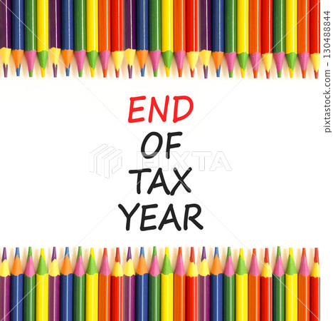 End of tax year symbol. Concept words phrase End of tax year on beautiful white paper. Colored pencils. Beautiful white paper background. Business End of tax year concept. Copy space. 130488844