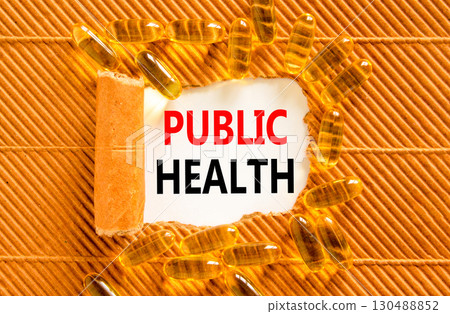 Public health symbol. Concept words Public health on beautiful white paper. Yellow pills tablets. Beautiful brown background. Medical healthy lifestyle public health concept. 130488852