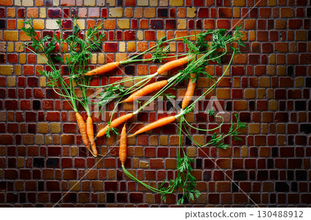 Mini Carrot vegetables on a tiles table Mini Carrot vegetables on a tiles table 130488912