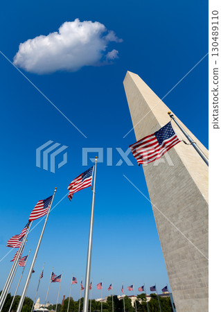Washington DC Monument and american flags US 130489110