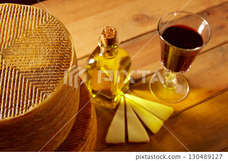 Manchego cheese from Spain in wooden table Manchego cheese from Spain in wooden table 130489127