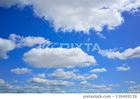 Blue sky with clouds in a summer day Blue sky with clouds in a summer day 130489139