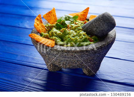 Guacamole with nachos in Mexican molcajete Guacamole with nachos in Mexican molcajete 130489156