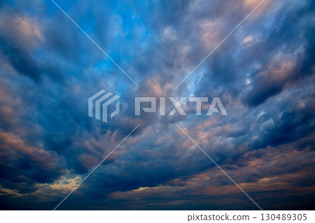 Dramatic sky with stormy clouds in sunset 130489305