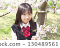 Elementary school student in uniform with cherry blossoms in the background 130489561