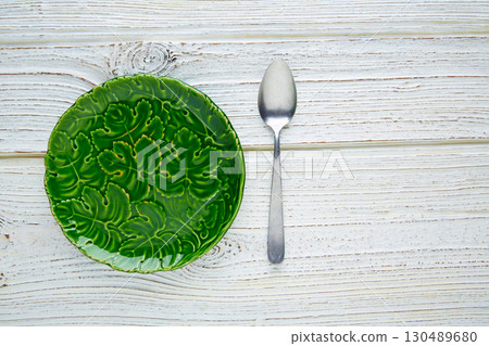 Empty plate dish with spoon food hungry concept 130489680