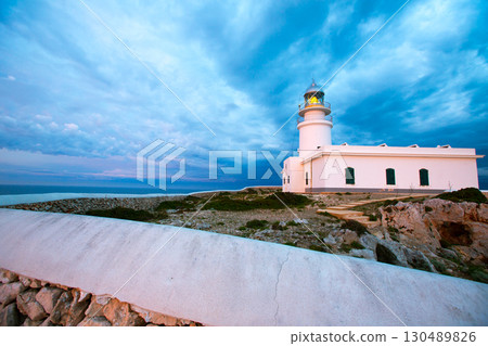 Menorca sunset at Faro de Caballeria Lighthouse Menorca sunset at Faro de Caballeria Lighthouse 130489826