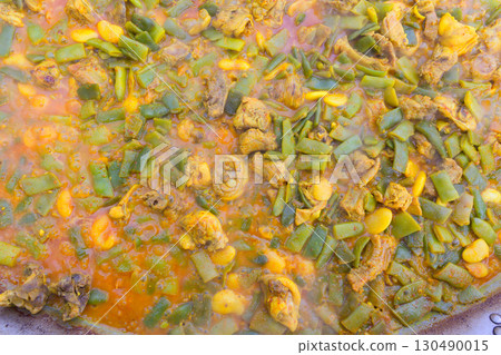 Cooking paella typical from Valencia Spain recipe with rice Cooking paella typical from Valencia Spain recipe with rice 130490015