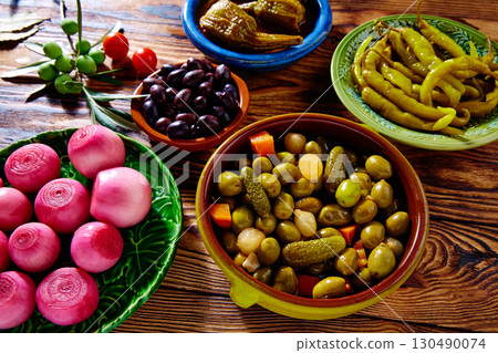Tapas pickles mix olives chili onion eggplant 130490074