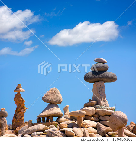 Stone figures on beach shore of Illetes beach in Formentera Stone figures on beach shore of Illetes beach in Formentera 130490103